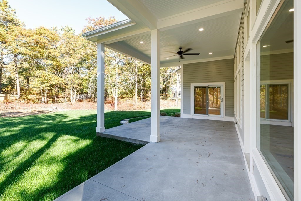 9 West Way Mashpee, MA 02649 - Photo 9 of 42 a view of a porch with a floor to ceiling window and garden