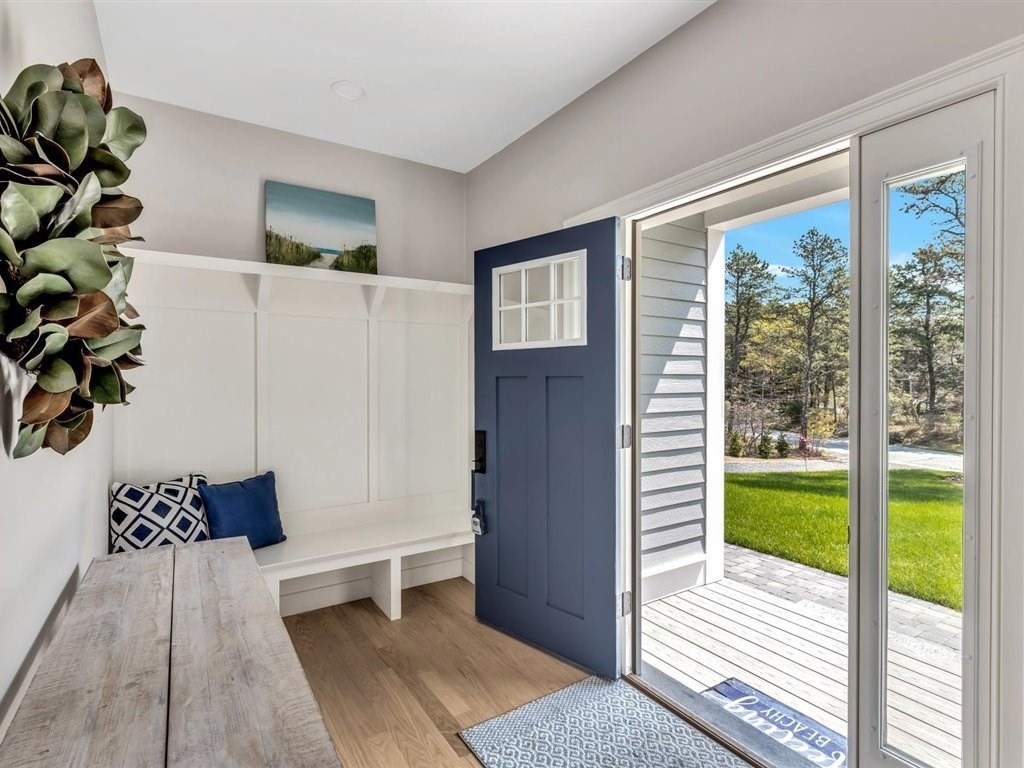 9 West Way Mashpee, MA 02649 - Photo 10 of 42 a view of a bedroom with a bed and a potted plant