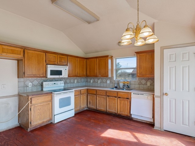 121 Meadowlake Lane Kempner, TX 76539 - Photo 4 of 14 a kitchen with stainless steel appliances granite countertop a sink dishwasher a microwave oven a stove with granite countertops and cabinets