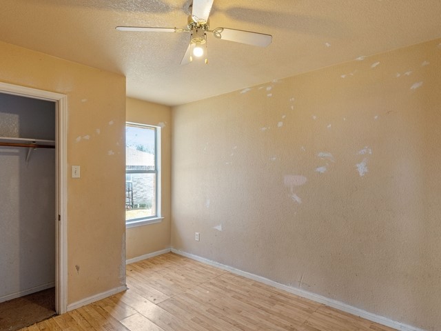 121 Meadowlake Lane Kempner, TX 76539 - Photo 10 of 14 an empty room with windows and fan