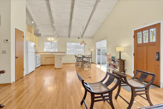 a view of a dining room with furniture window and wooden floor