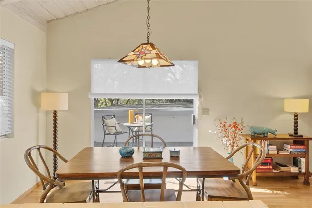 a living room with furniture a fireplace and flat screen tv