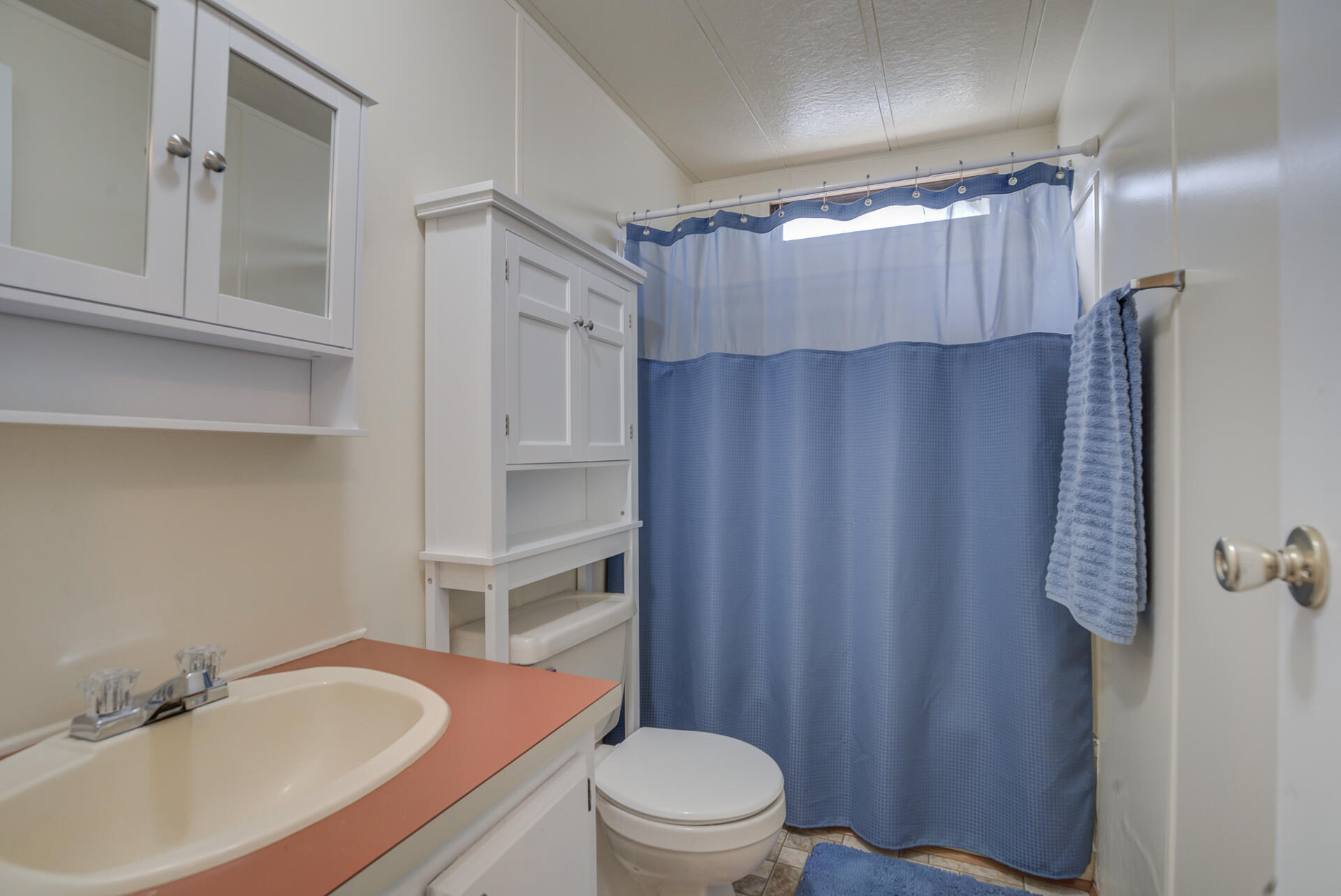 2873 Arcade Redding Ca, Unit STARLITE Redding, CA 96002 - Photo 22 of 32 a bathroom with a sink toilet and shower