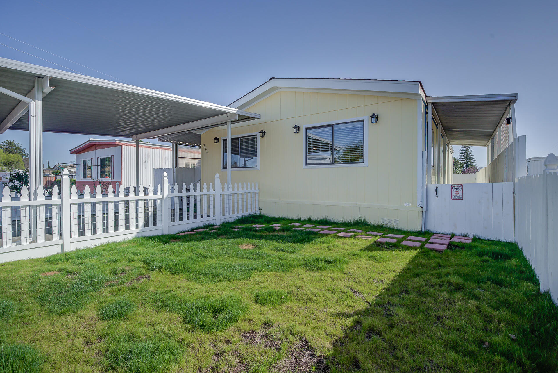 2873 Arcade Redding Ca, Unit STARLITE Redding, CA 96002 - Photo 31 of 32 a view of an house with backyard and porch