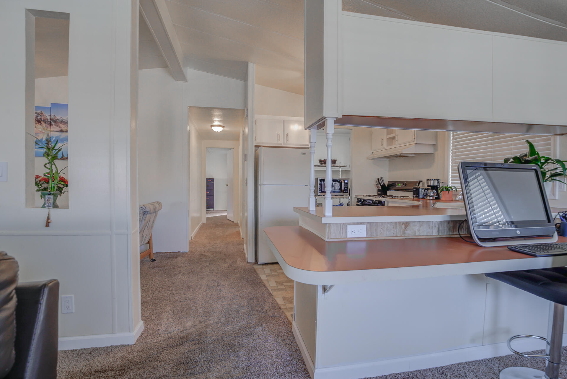 2873 Arcade Redding Ca, Unit STARLITE Redding, CA 96002 - Photo 9 of 32 a large kitchen with stainless steel appliances a large counter top a stove and a refrigerator