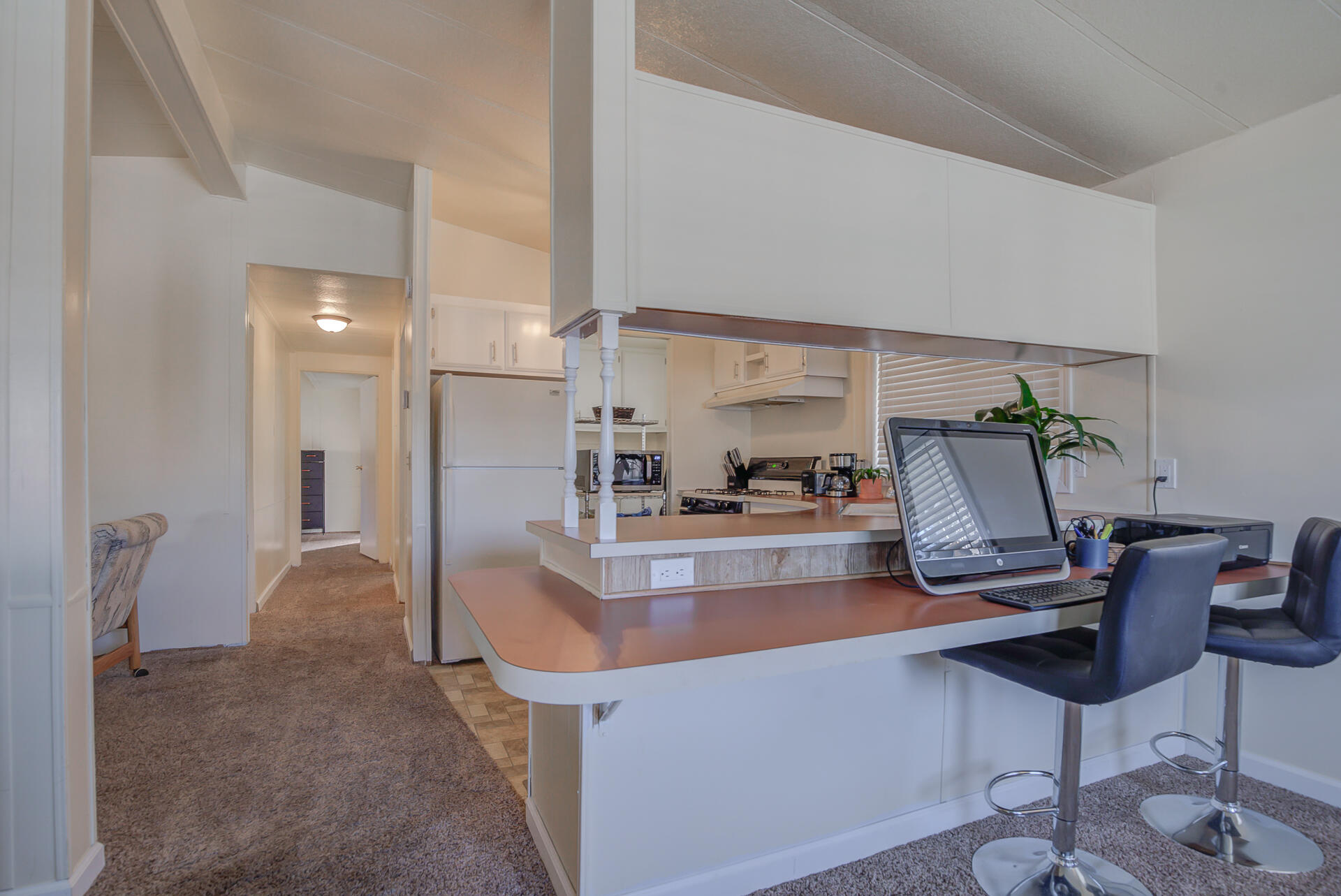 2873 Arcade Redding Ca, Unit STARLITE Redding, CA 96002 - Photo 10 of 32 a living room with furniture and a chandelier
