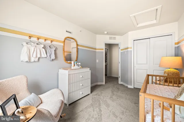 a bedroom with a bed and a mirror