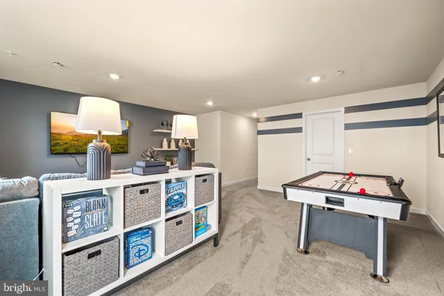 a room with furniture a flat screen tv and a table