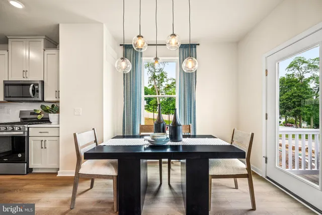 a view of a dining room with furniture window and outside view