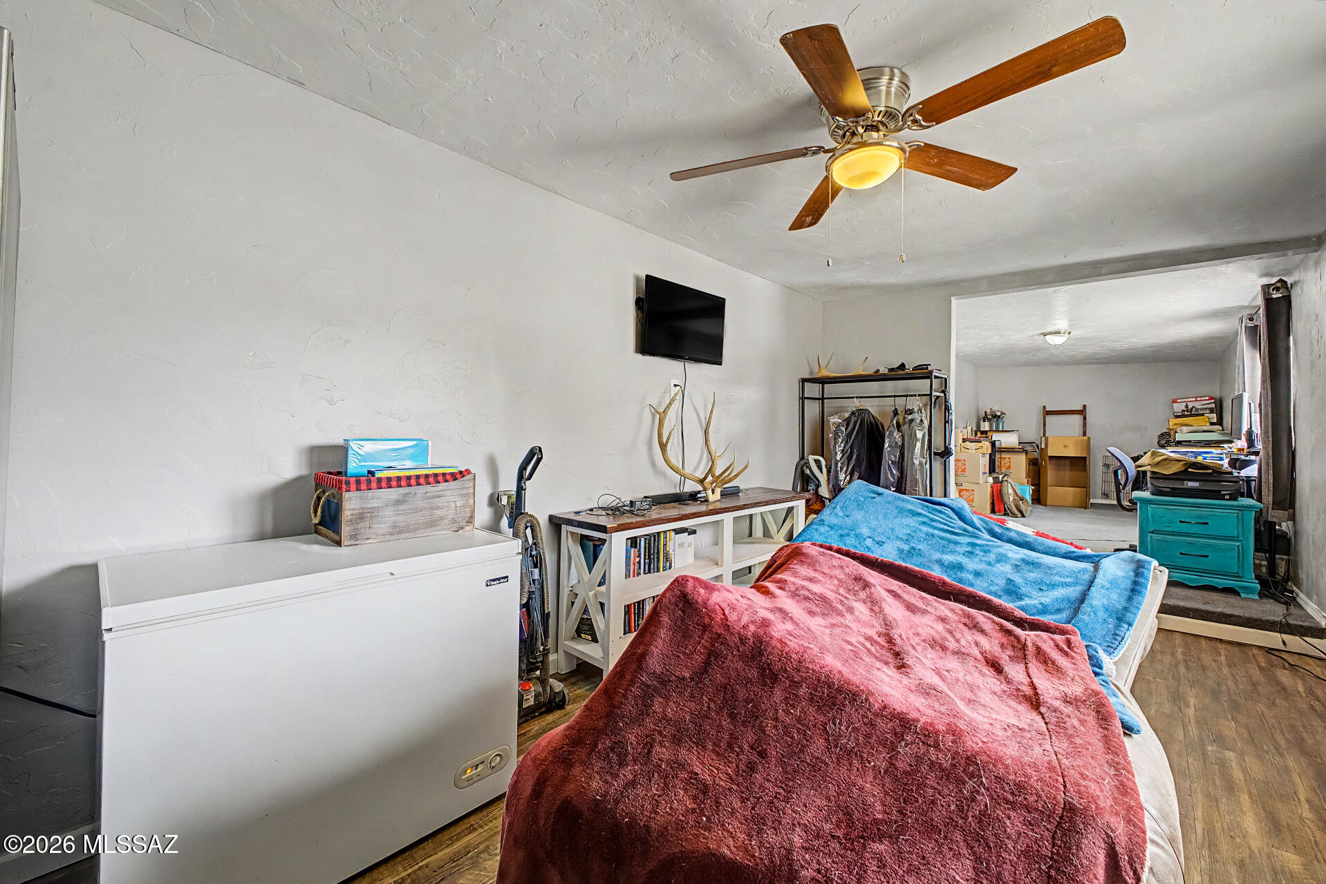 4231 East Pinal Street Tucson, AZ 85739 - Photo 22 of 36 a bed room with a bed and a television
