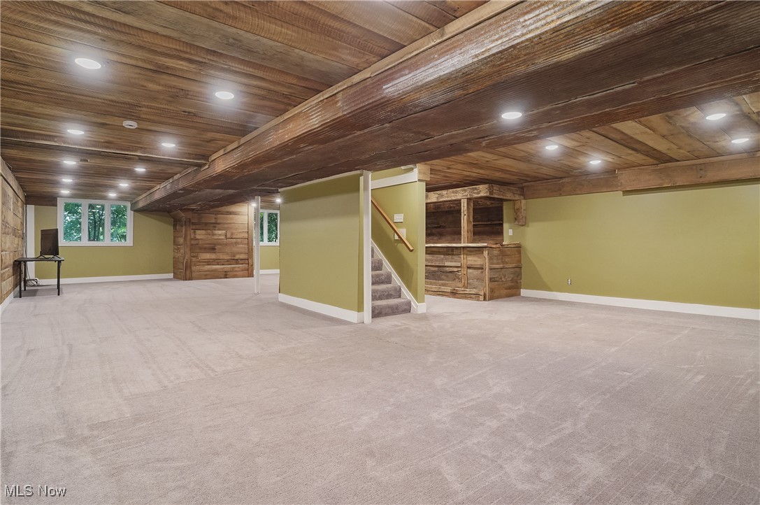 1453 Prospect Road Hudson, OH 44236 - Photo 34 of 50 Basement with wooden ceiling, stairs, carpet, and recessed lighting