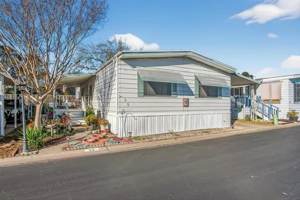 a front view of a house with a garage