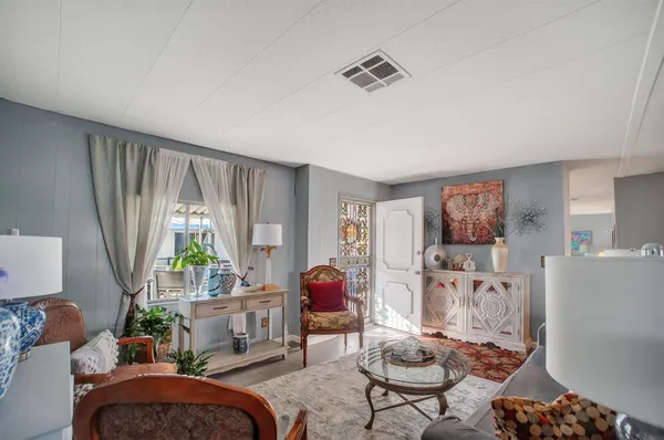 a living room with furniture and a window