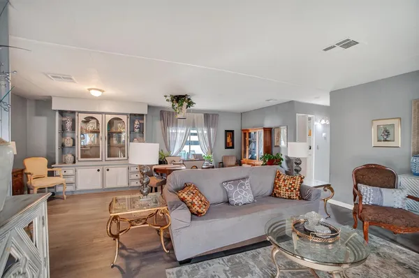 a living room with furniture and a window