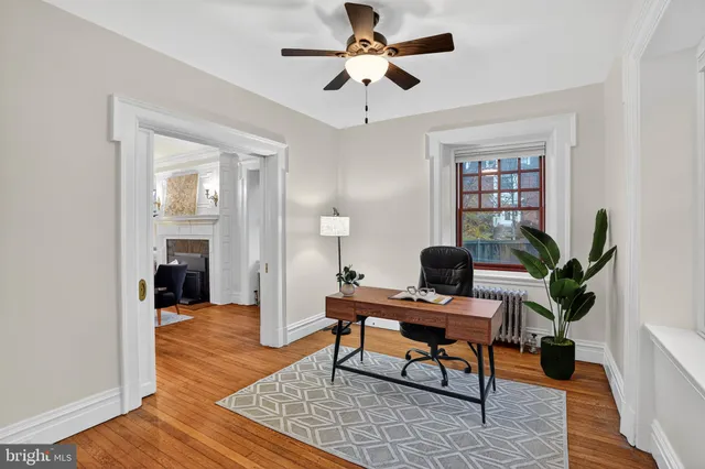 a bathroom with a sink toilet and a mirror