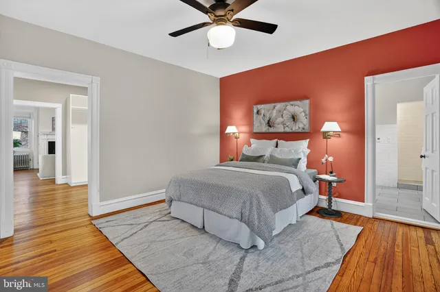 a hallway view with wooden floor and closet
