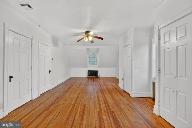 a front view of a house with a yard and outdoor seating