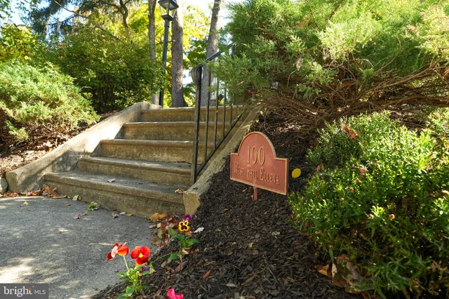 a front view of a building with garden