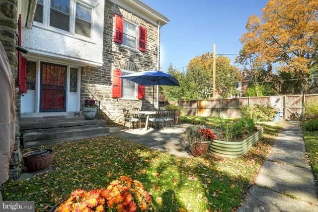 a view of front door of house with a large window