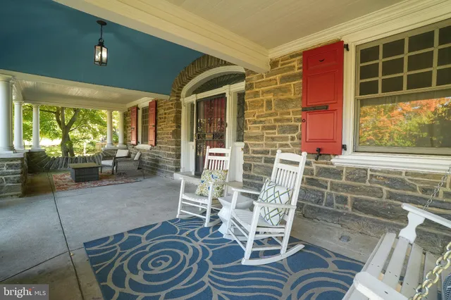 a view of a chairs and table in a patio