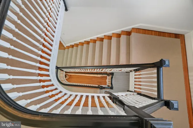 a view of a livingroom with furniture and hardwood floor