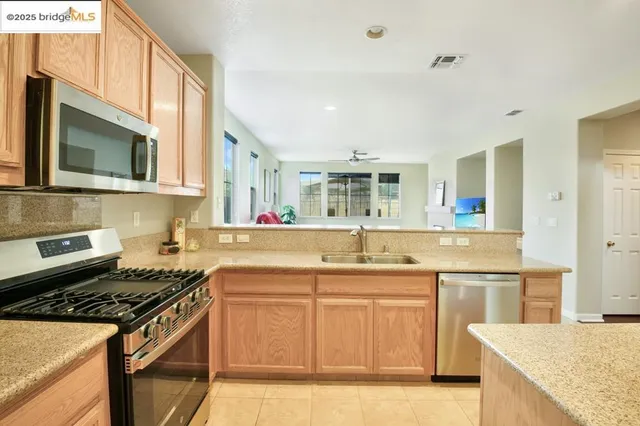 a dining room with furniture a fireplace and wooden floor