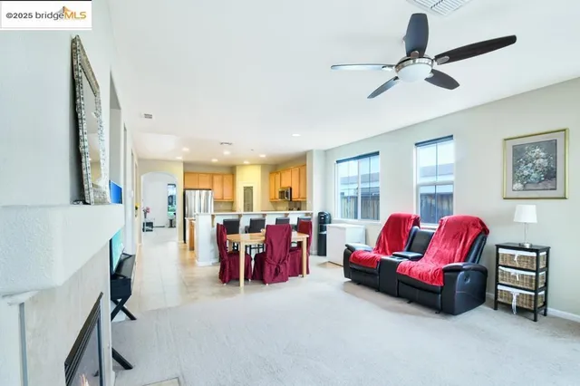 a view of a hallway with wooden floor and dining room