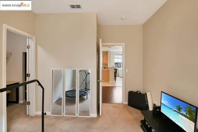 a bathroom with a granite countertop sink shower and a mirror