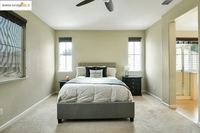 a bedroom with a bed and a television