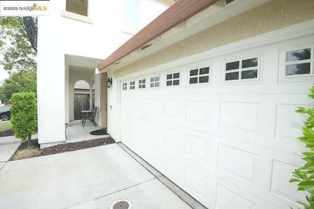 a front view of a house with a garage