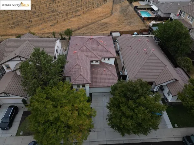 an aerial view of multiple houses with outdoor space