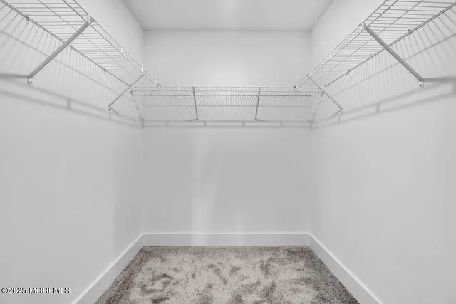 a bathroom with a sink a mirror and a shower