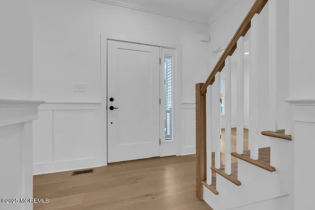 a kitchen with stainless steel appliances a sink stove and cabinets