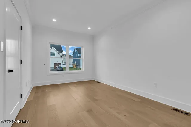 a view of a backyard with plants and a garden