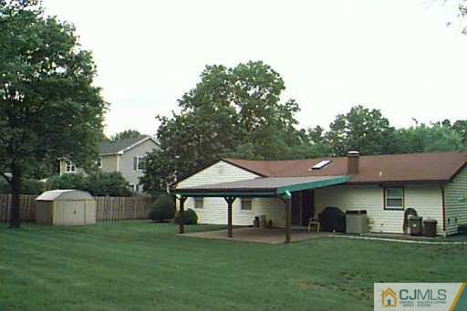 41 MacAfee Road Somerset, NJ 08873 - Photo 2 of 8 a backyard of a house with table and chairs