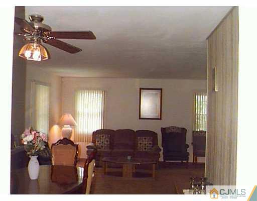 41 MacAfee Road Somerset, NJ 08873 - Photo 5 of 8 a living room with furniture flowerpot and window