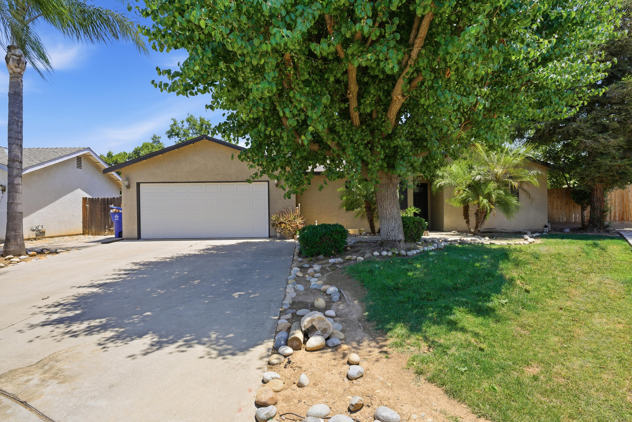 618 Birdsong Court Exeter, CA 93221 - Photo 2 of 62 a front view of a house with a yard