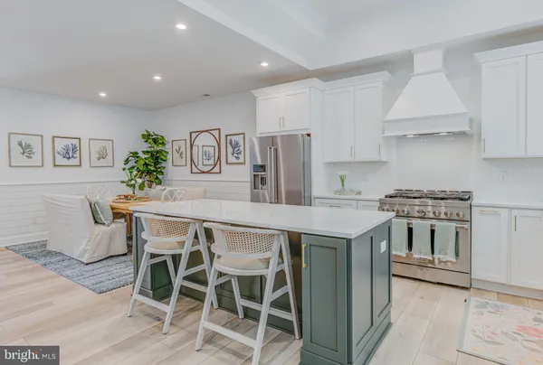 a kitchen that has a table and chairs in it