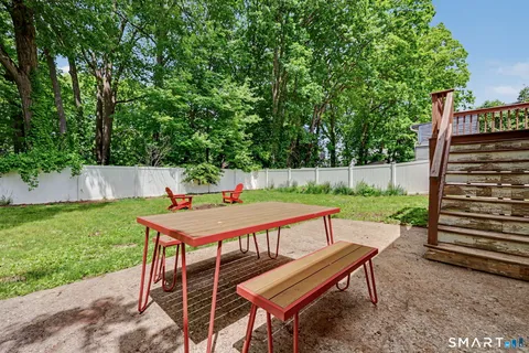 a outdoor view with a sitting space and garden
