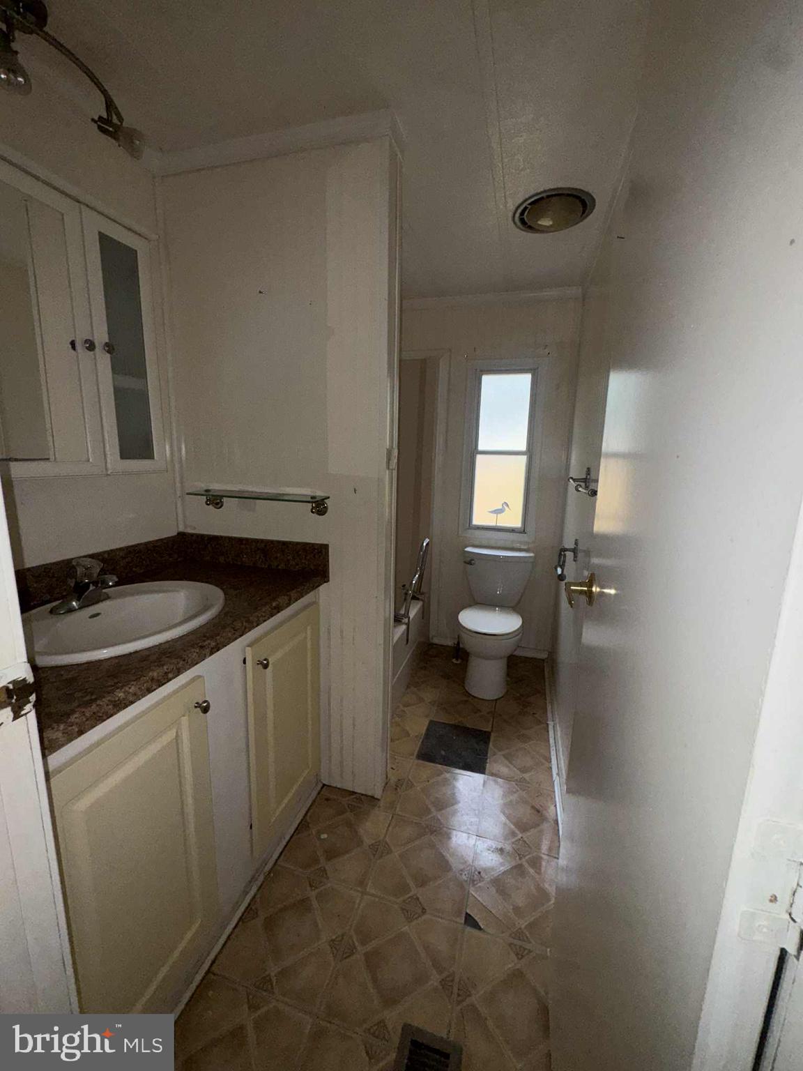 31061 Vacation Road Millsboro, DE 19966 - Photo 11 of 12 a kitchen with a sink and a stove