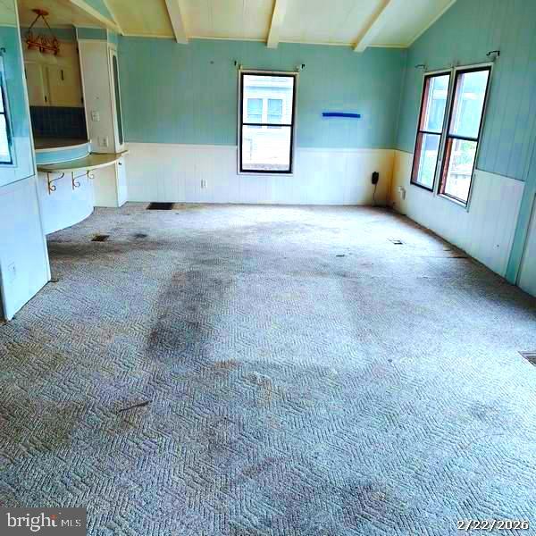 31061 Vacation Road Millsboro, DE 19966 - Photo 3 of 12 a view of an empty room with a fireplace and a window