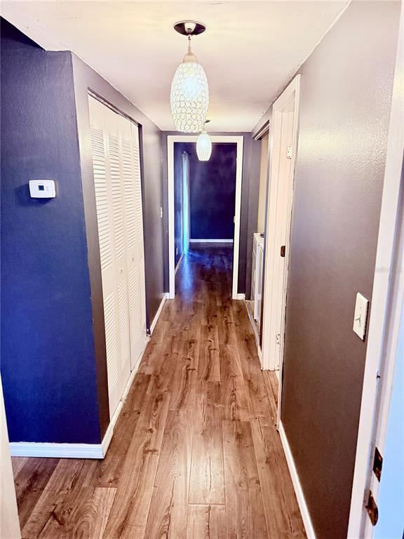 6519 West Newberry Road, Unit 211 Gainesville, FL 32605 - Photo 14 of 20 a view of gallery with wooden floor