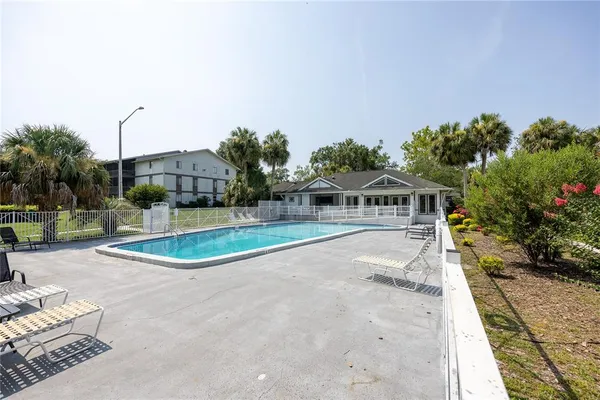a view of a swimming pool with a yard