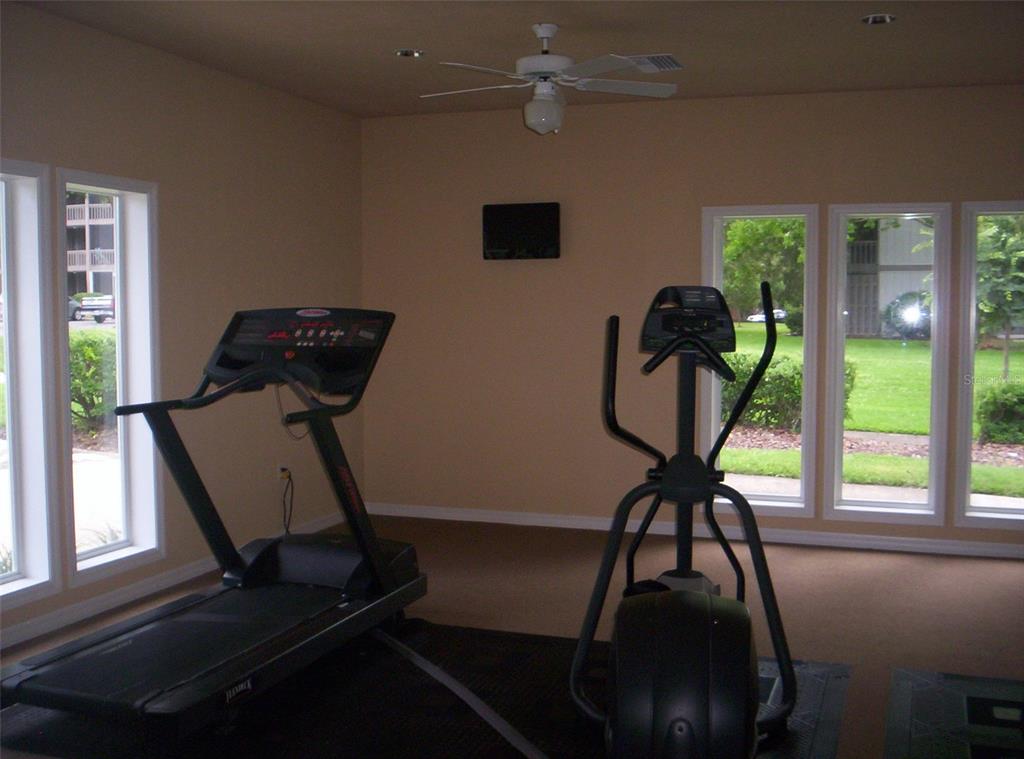 6519 West Newberry Road, Unit 211 Gainesville, FL 32605 - Photo 18 of 20 a view of a workspace with furniture and a window