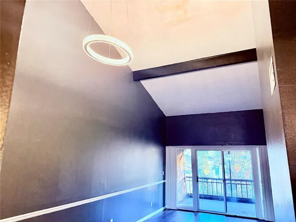 a view of a door and wooden floor