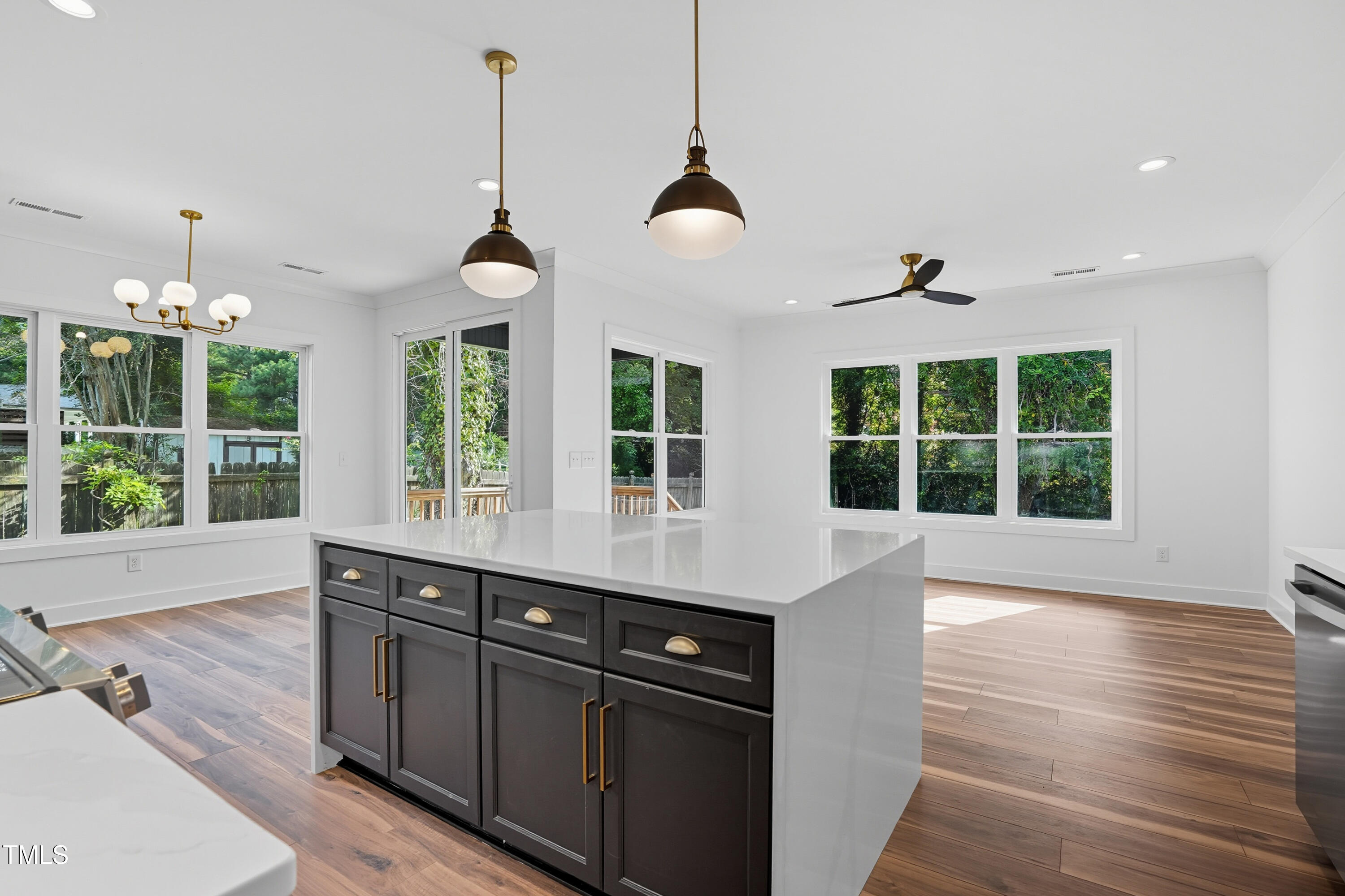 304 North King Charles Road, Unit 102 Raleigh, NC 27610 - Photo 17 of 30 a view of a kitchen with a sink stainless steel appliances and cabinets