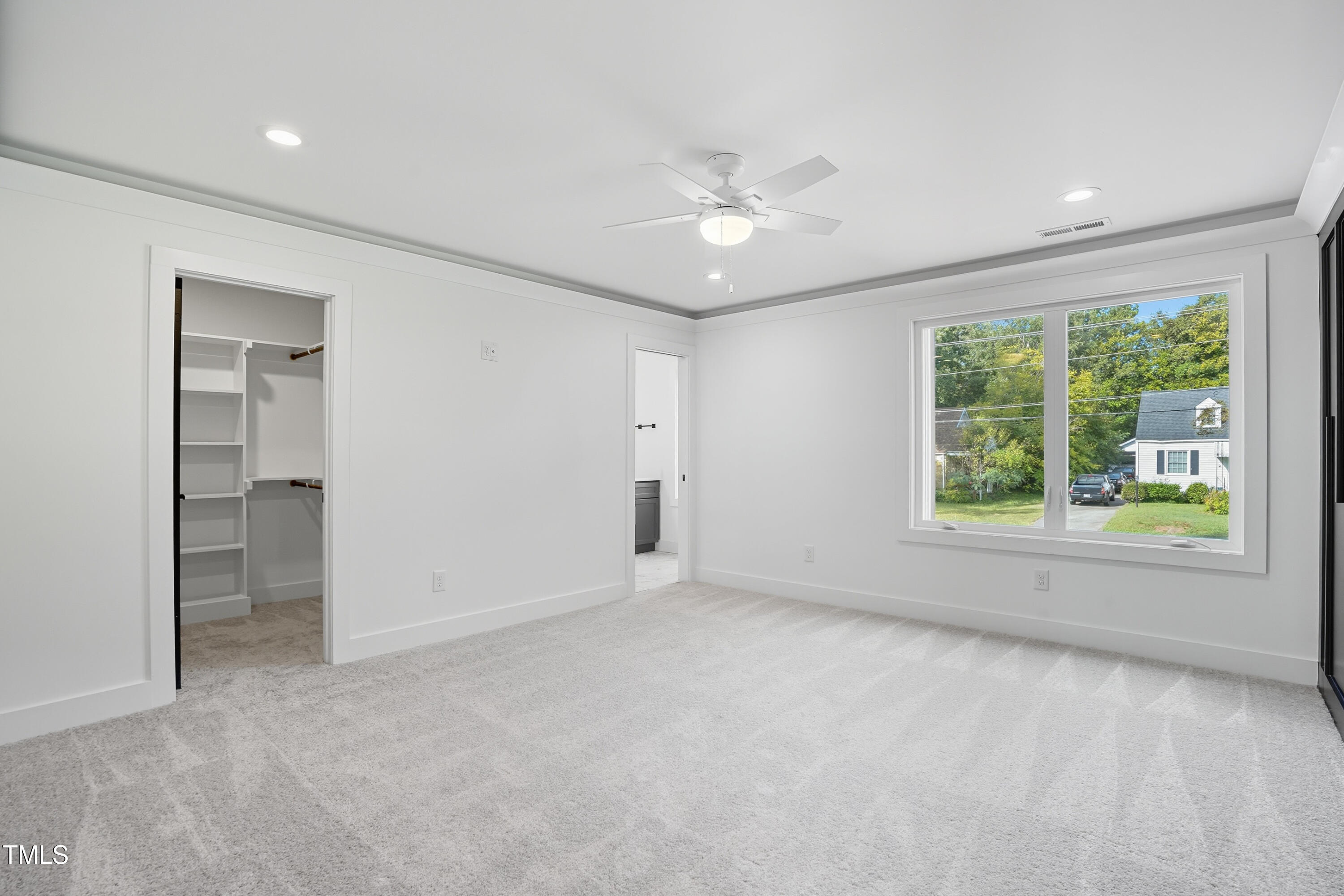 304 North King Charles Road, Unit 102 Raleigh, NC 27610 - Photo 20 of 30 wooden floor in an empty room with a window