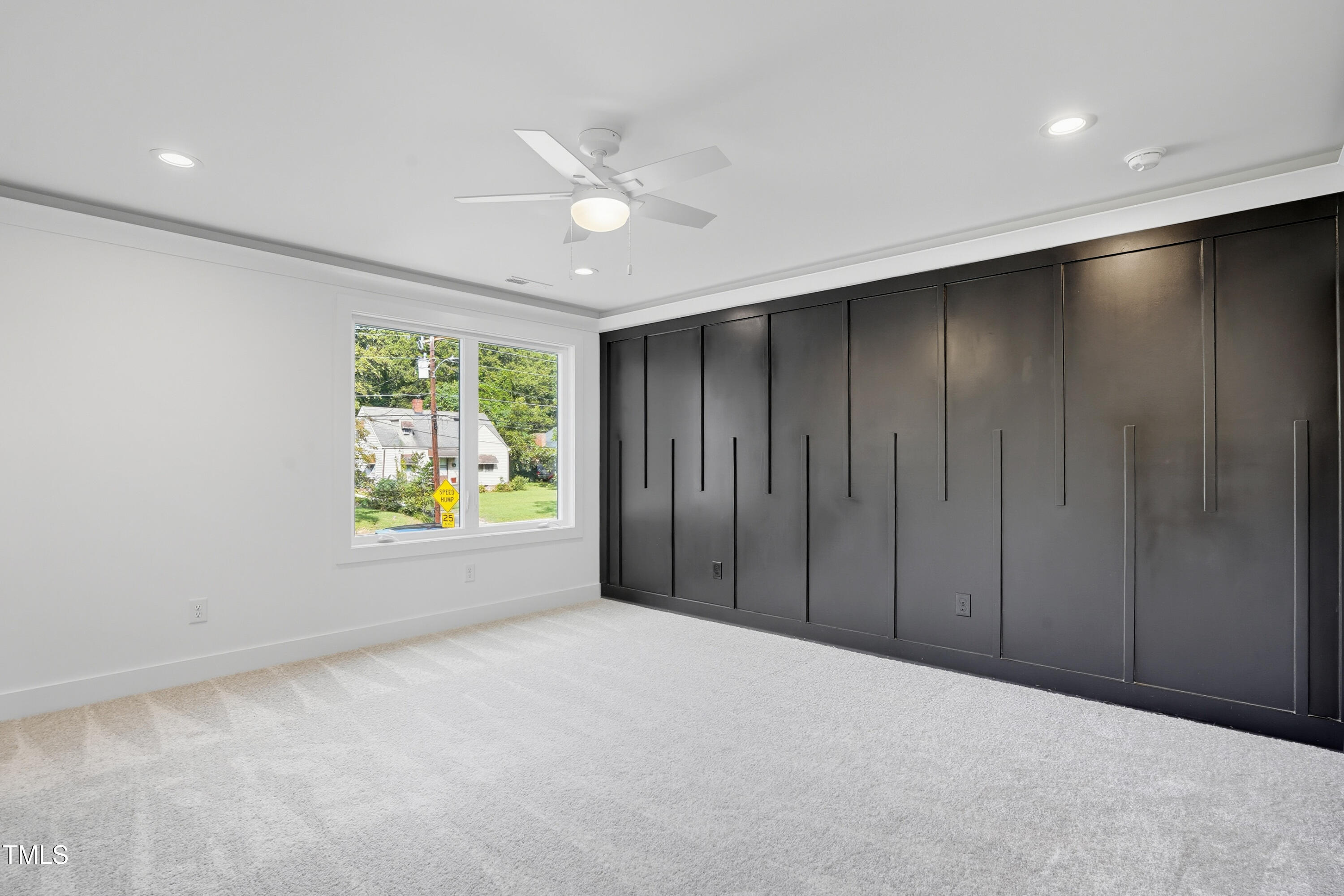 304 North King Charles Road, Unit 102 Raleigh, NC 27610 - Photo 21 of 30 a view of an empty room with a window