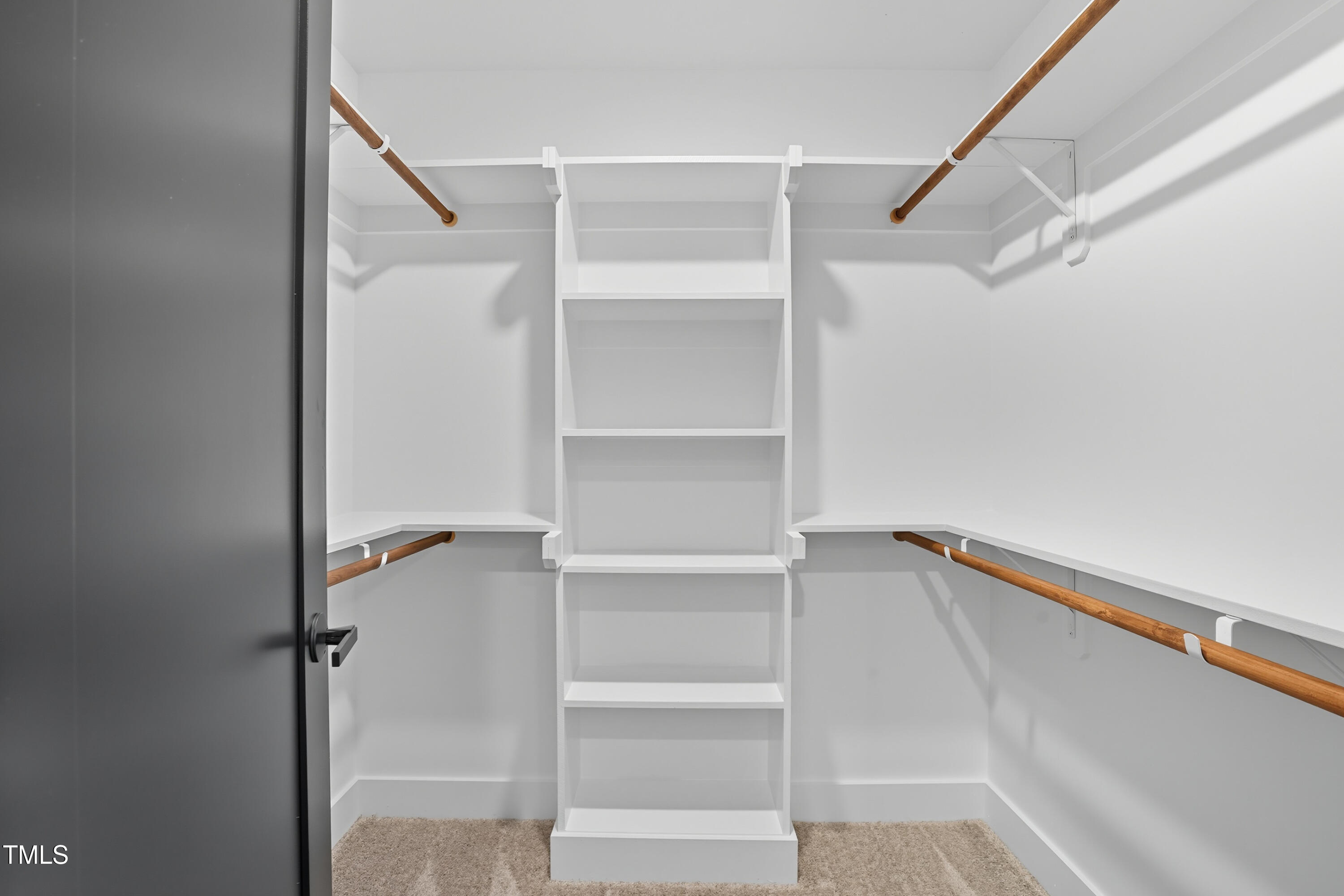 304 North King Charles Road, Unit 102 Raleigh, NC 27610 - Photo 22 of 30 a view of walk in closet with empty racks