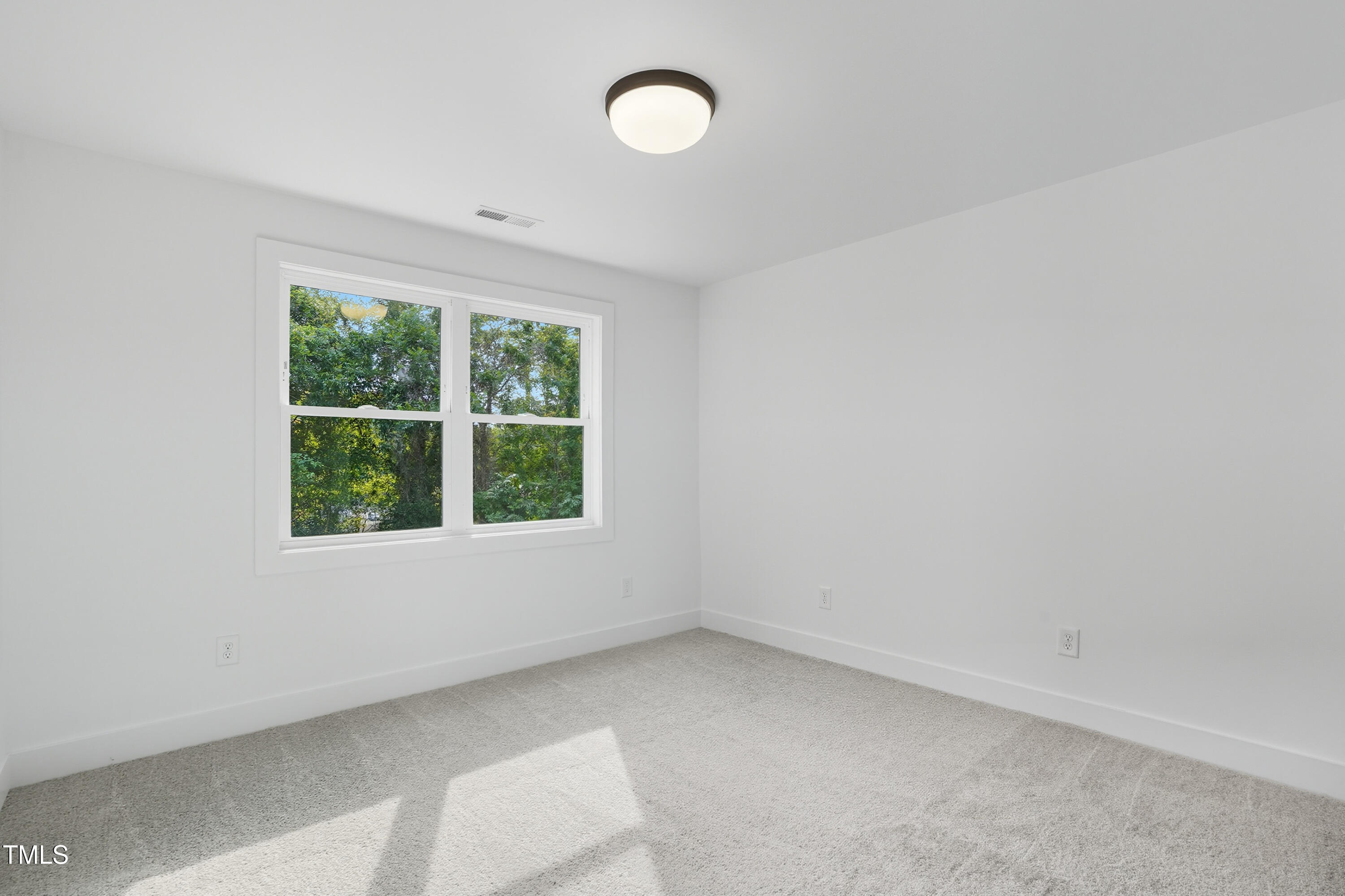 304 North King Charles Road, Unit 102 Raleigh, NC 27610 - Photo 26 of 30 an empty room with a window